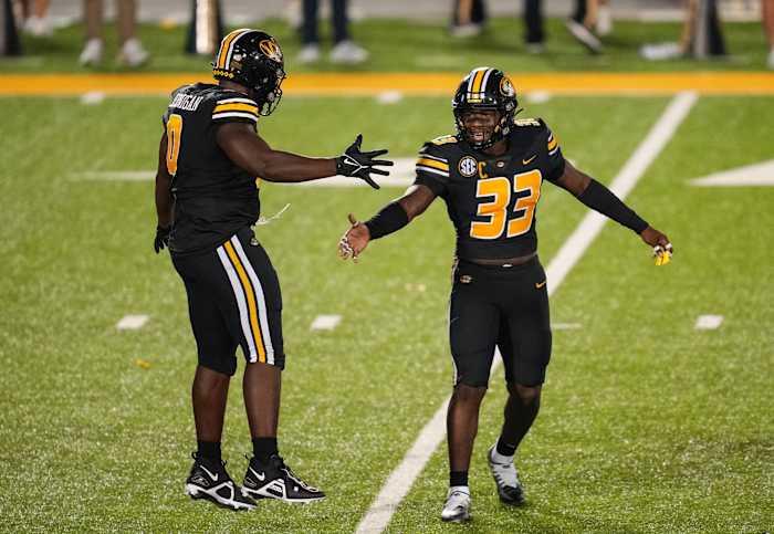 Sep 1, 2022; Columbia, Missouri, USA; Missouri Tigers defensive lineman Jayden Jernigan (0) celebrates with linebacker Chad Bailey (33) after a sack against the Louisiana Tech Bulldogs during the second half at Faurot Field at Memorial Stadium. Mandatory Credit: Jay Biggerstaff-USA TODAY Sports